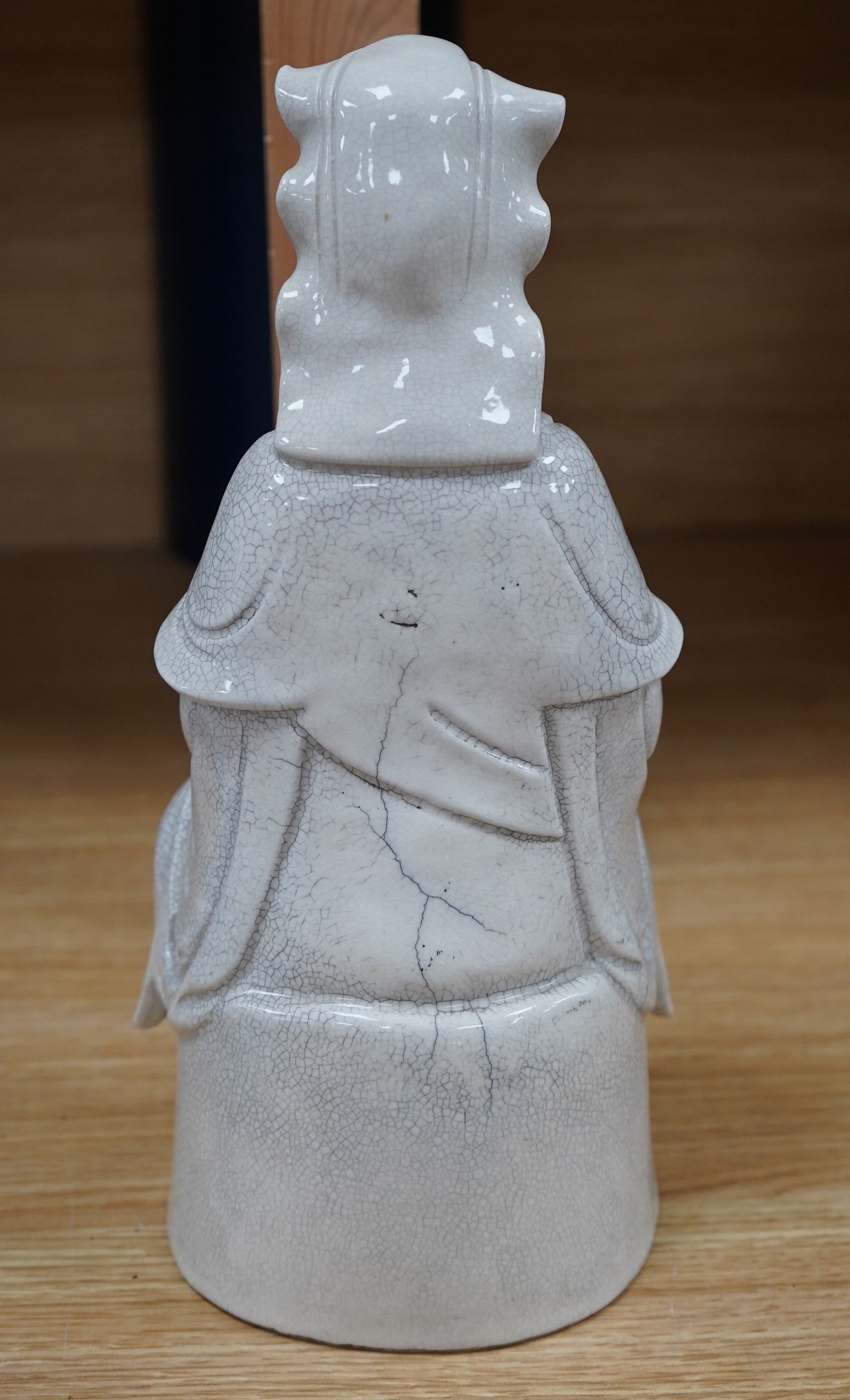 A late 19th/early 20th century Chinese crackle glaze figure of Guanyin, 30cm high. Condition - fair